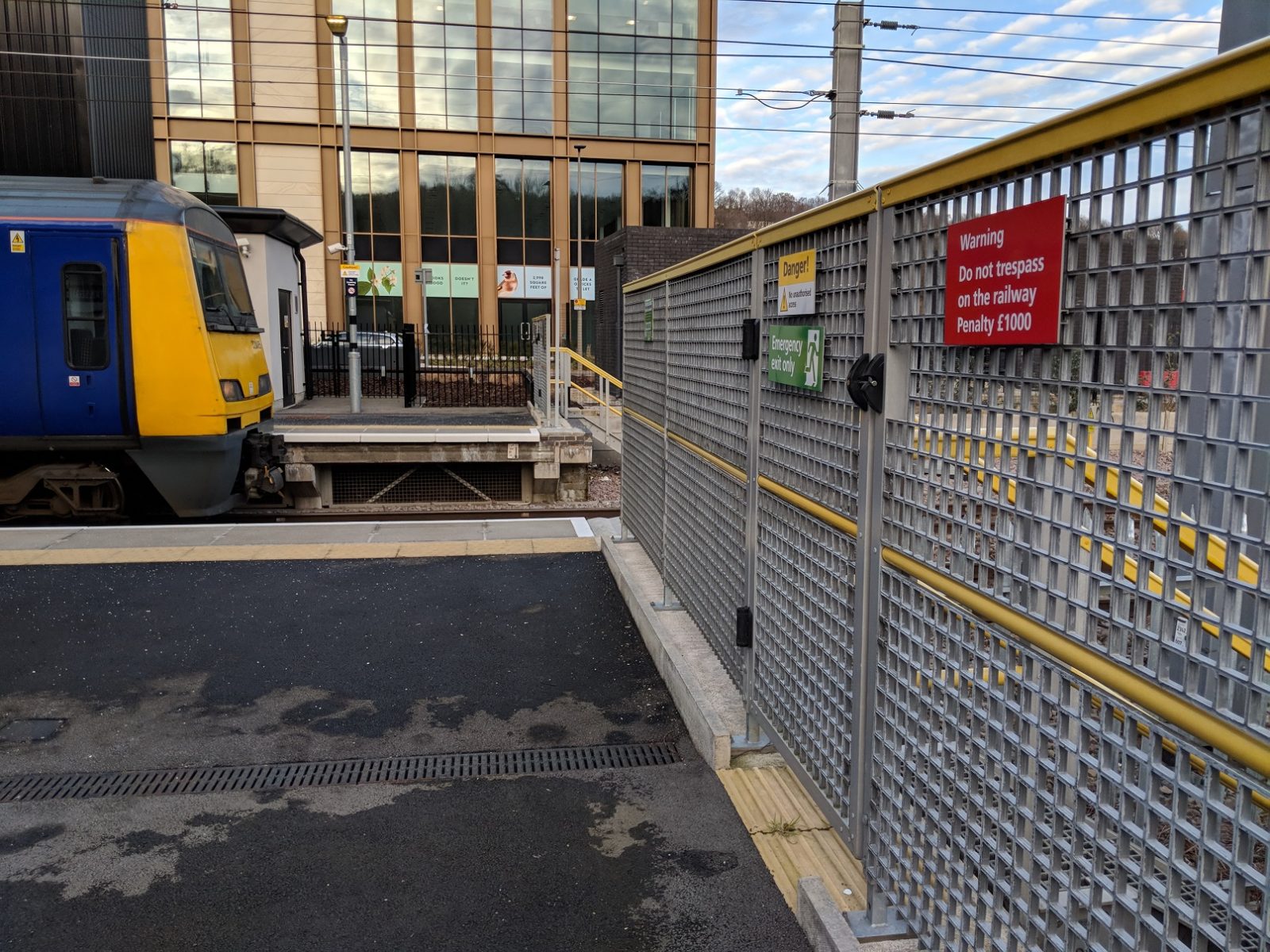 Grated Gate and Railway Fence at a Train Station