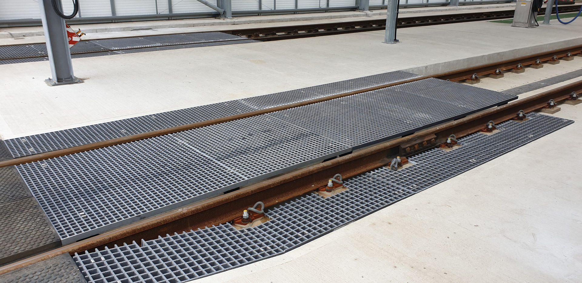 Fibreglass grating train care depot crossing points